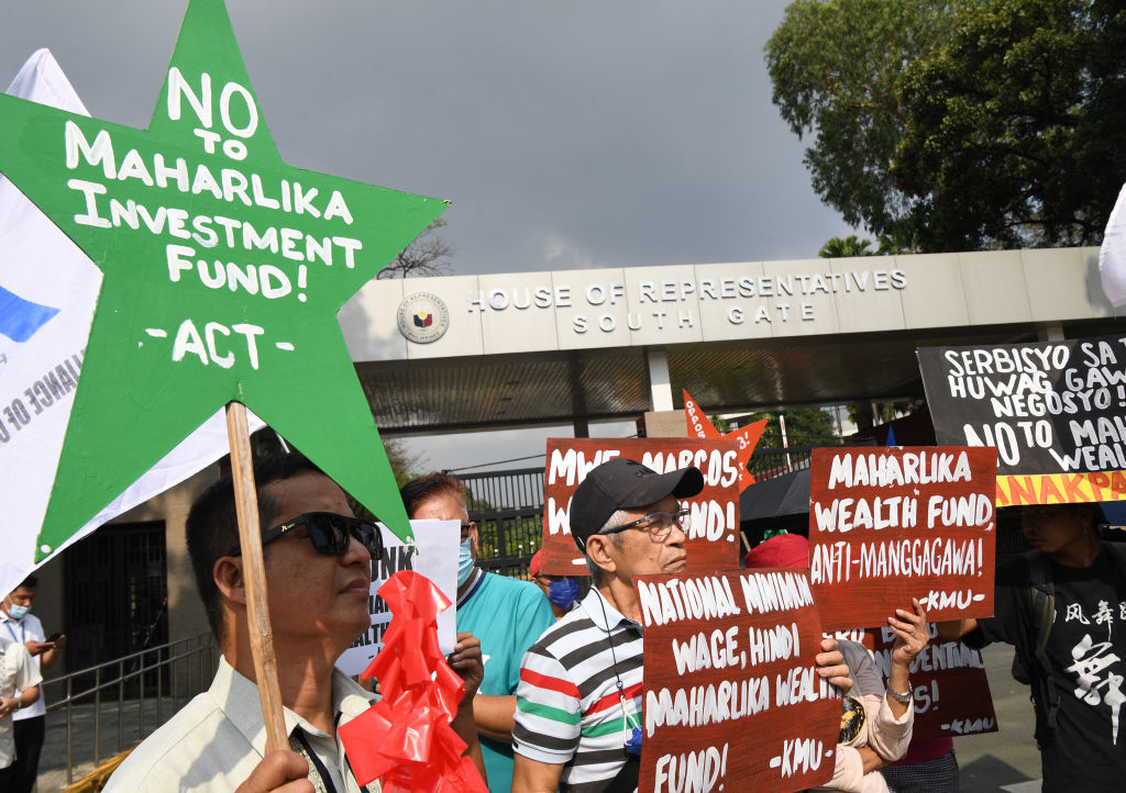 Protesters demonstrate against the Philippines' proposed sovereign wealth fund in front of the House of Representatives in Quezon City on Dec. 12, 2022. (Ted Aljibe—AFP/Getty Images)