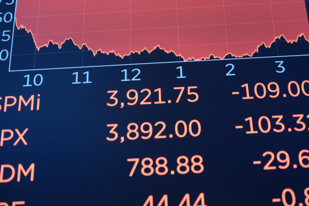 A board on the floor of the  New York Stock Exchange (NYSE) shows a steep decline on December 15, 2022 in New York City. Stocks fell over 700 points as investors reacted to news that the Federal Reserve will continue to raise interest rates to fight back against inflation. (Spencer Platt-Getty Images)