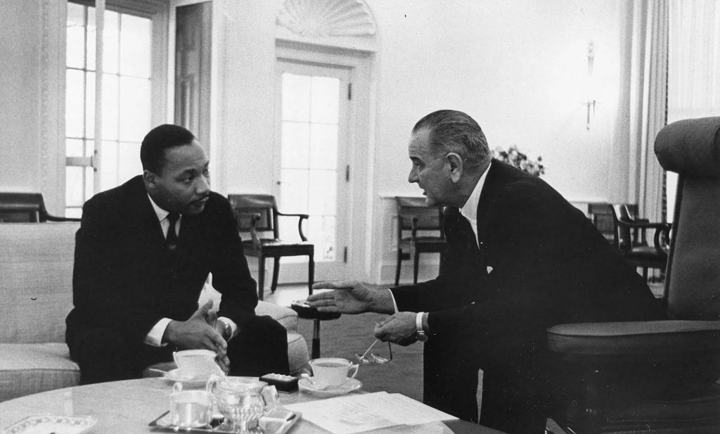 President Lyndon B Johnson with US Civil Rights leader Dr Martin Luther King Jr at the White House,Washington DC, December 1963. Dr King, head of the Southern Christian Leadership Conference, was one of the civil rights leaders who consulted with the new president. (Okamoto-PhotoQuest/Getty Images)