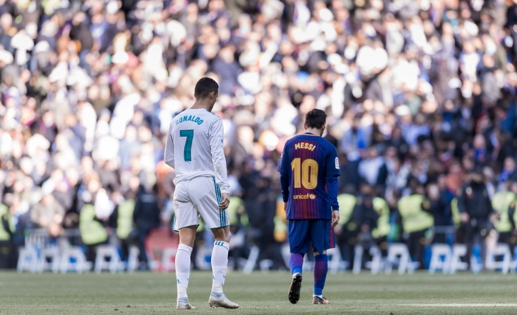 Lionel Messi of Barcelona and Cristiano Ronaldo of Real Madrid walk off the pitch during a La Liga match at Santiago Bernabeu stadium in Madrid, Spain, on Dec. 23, 2017. (Power Sport Images/Getty Images)
