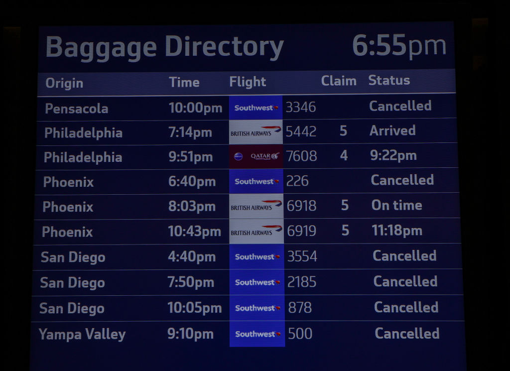 An information board is seen by the Southwest Airlines counter at San Francisco International Airport on Dec. 26, 2022 as Southwest cancels more than 2,800 U.S. flights on Monday amid fierce winter storms. (Tayfun Coskun–Anadolu Agency/Getty Images)