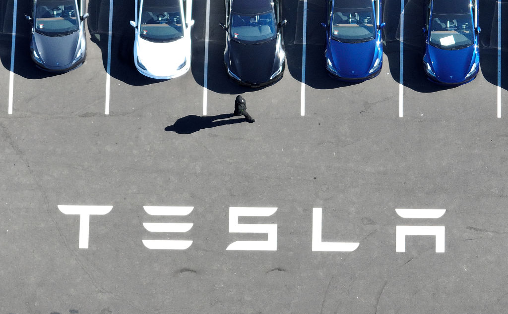 In an aerial view, brand new Tesla cars sit in a parking lot at the Tesla factory on Oct. 19, 2022 in Fremont, Calif. (Justin Sullivan–Getty Images)