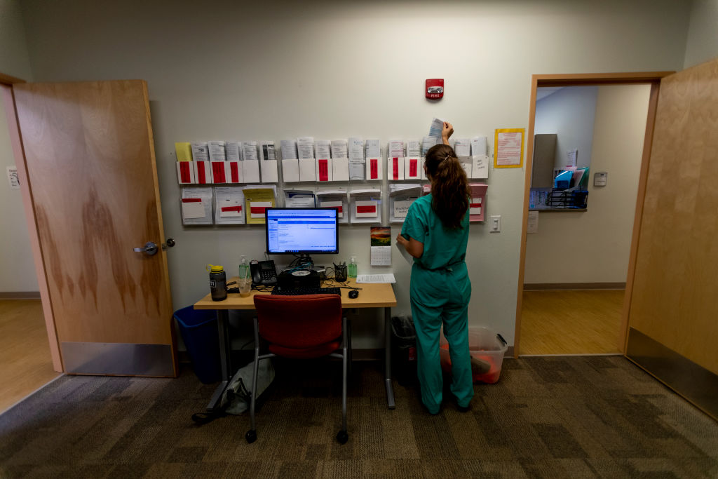 A resident pulls paperwork for an abortion patient the day before the Supreme Court overturned Roe v. Wade at the Center for Reproductive Health clinic on June 23, 2022 in Albuquerque, New Mexico. (Gina Ferazzi / Los Angeles Times—Getty Images)