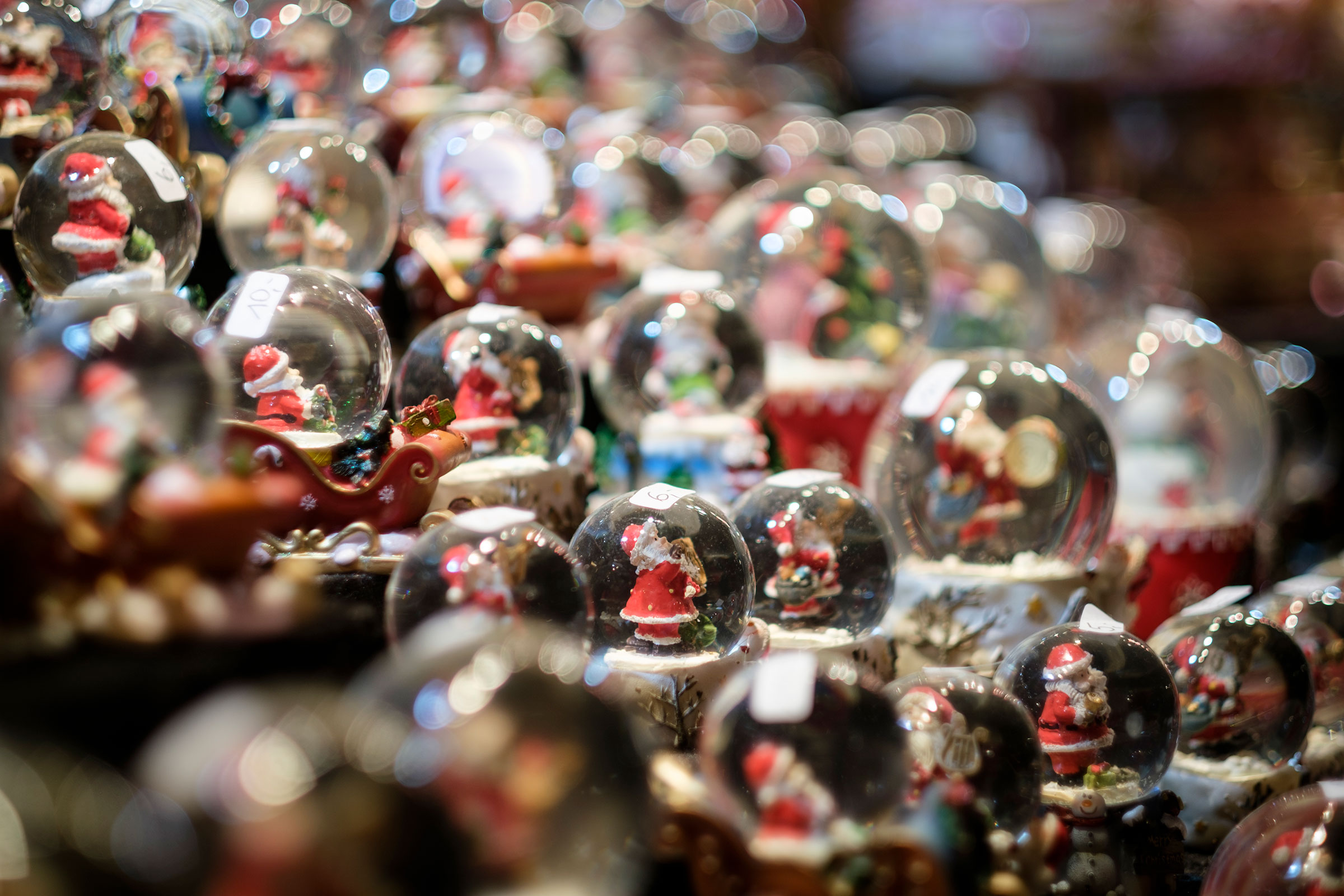 Snow globes displayed for sale at the Christmas Market on Dec. 21, 2021 in Aachen, Germany. (Thierry Monasse—Getty Images)