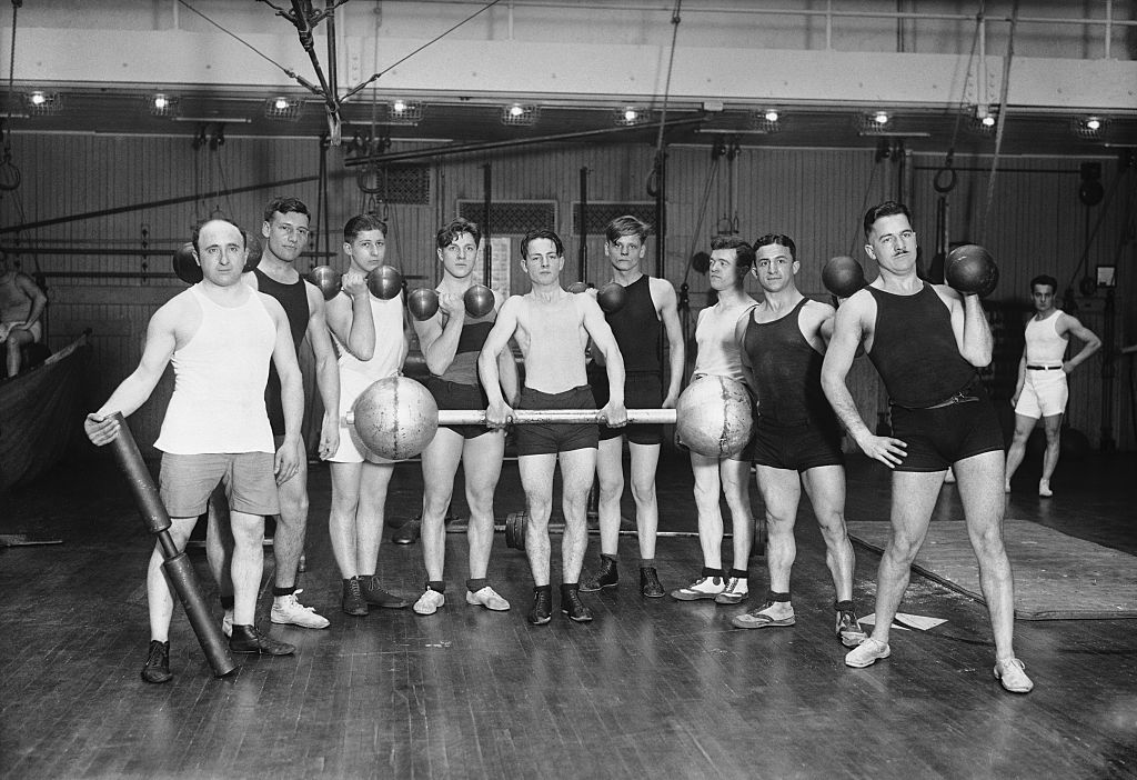 A 1922 photo of N.Y.C. officer workers showing off their weight-lifting skills. (Bettmann Archive)