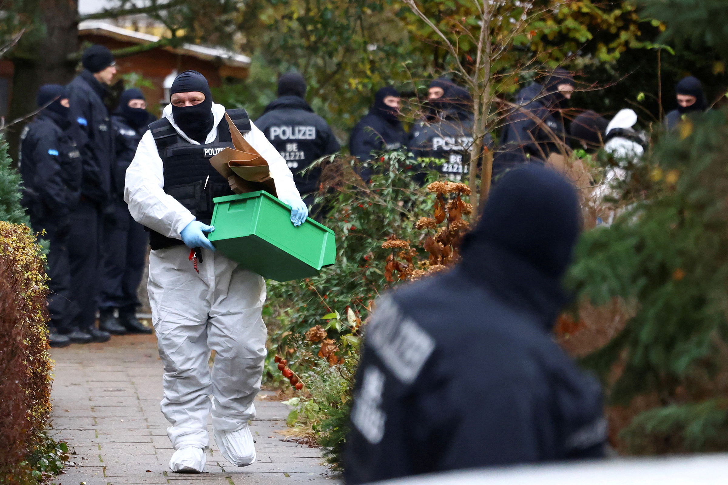 Police secure an area in Berlin after 25 suspected members and supporters of a far-right group were detained during raids across Germany, Dec. 7, 2022.