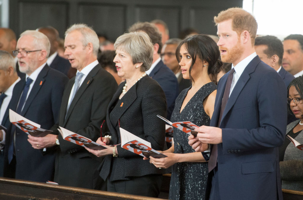 Then-Labour Leader Jeremy Corbyn (L) Prime Minister Theresa May (C), Prince Harry (R) and Meghan Markle (2nd,R) attend a memorial service at St Martin-in-the-Fields in Trafalgar Square to commemorate the 25th anniversary of the murder of Stephen Lawrence on April 23, 2018, in London, England. (David Parker-WPA Pool—Getty Images)