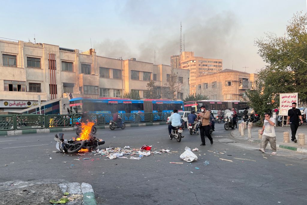A picture obtained by AFP outside Iran, shows a motorcycle burning in the capital Tehran, during the current protests on October 8, 2022. (AFP/Getty Images)