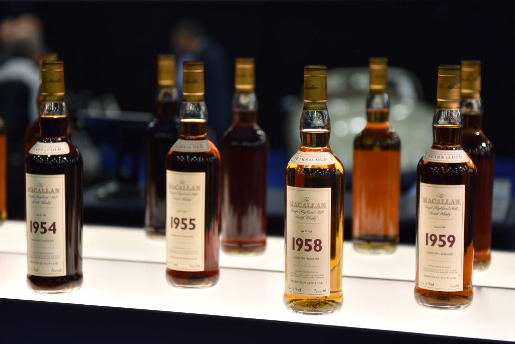 Bottles of various years old Macallan highland single malt whisky are displayed during the RM Sotherb's London, European car collectors event at Olympia London on Oct. 23, 2019 in London, England. (John Keeble—Getty Images)