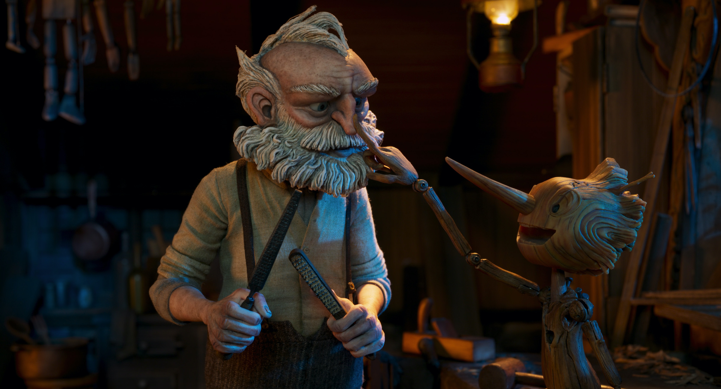 Gepetto (voiced by David Bradley) and Pinocchio (voiced by Gregory Mann) in Guillermo del Toro's Pinocchio (Courtesy of Netflix)