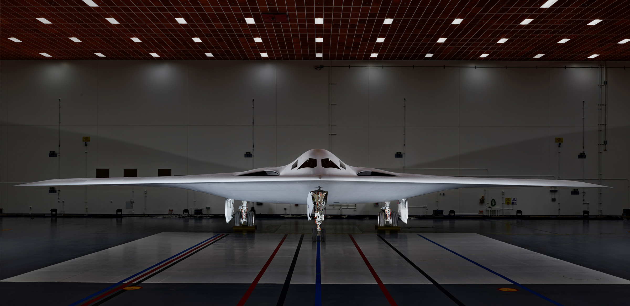 The <a href="https://time.com/6238168/b-21-raider-bomber-us-military-exclusive/">B-21 stealth bomber</a>—the U.S. military’s newest covert aircraft—sits inside a hangar at Northrop Grumman’s facilities at Plant 42 in Palmdale before its Dec. 2 public unveiling, on Nov. 29. (Christopher Payne for TIME)