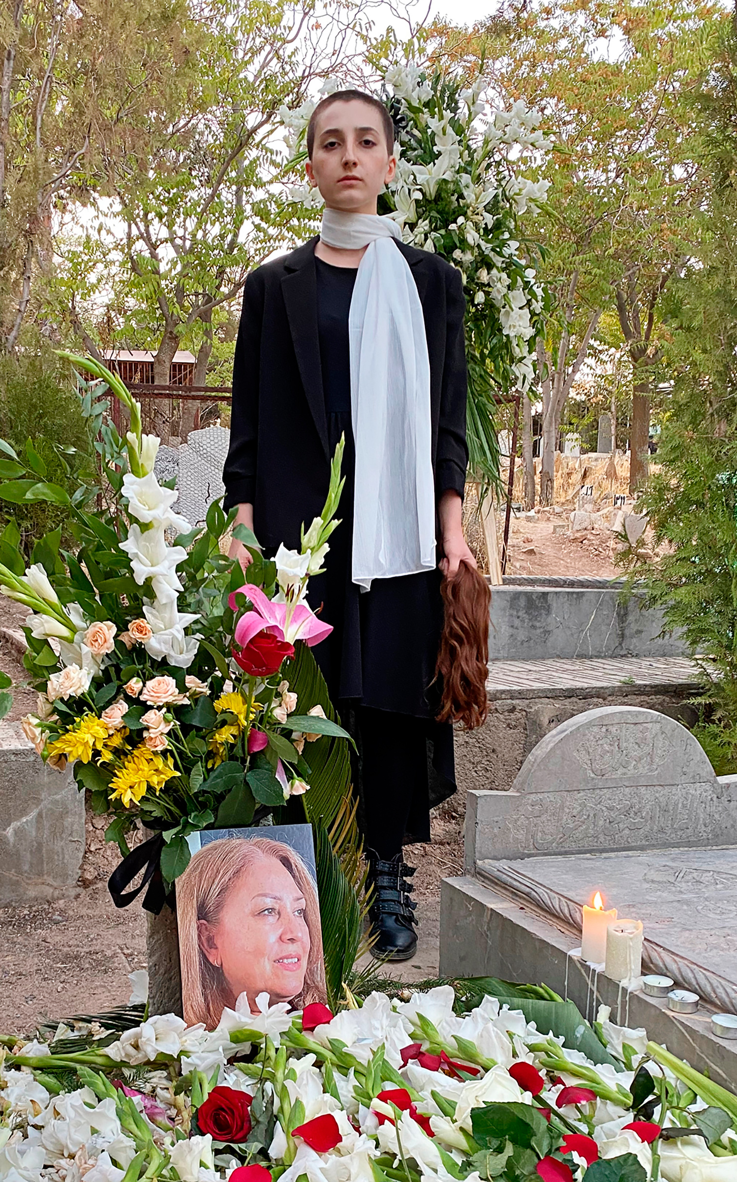 Roya Piraei next to her mother's grave. (Courtesy Roya Piraei)
