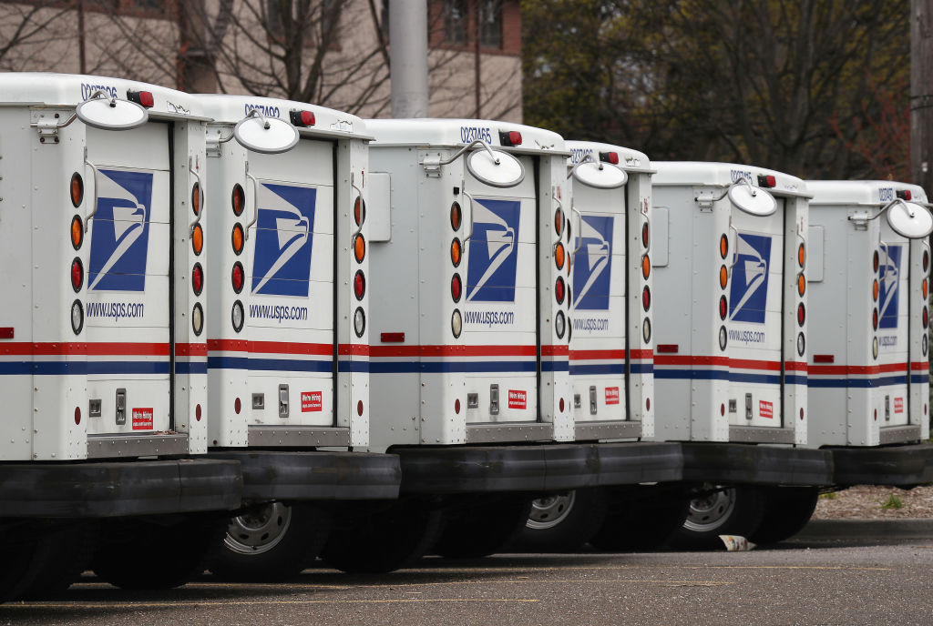 A general view of United States Postal Service trucks on April 12, 2020 in Farmingdale, New York. (Bruce Bennett—Getty Images)