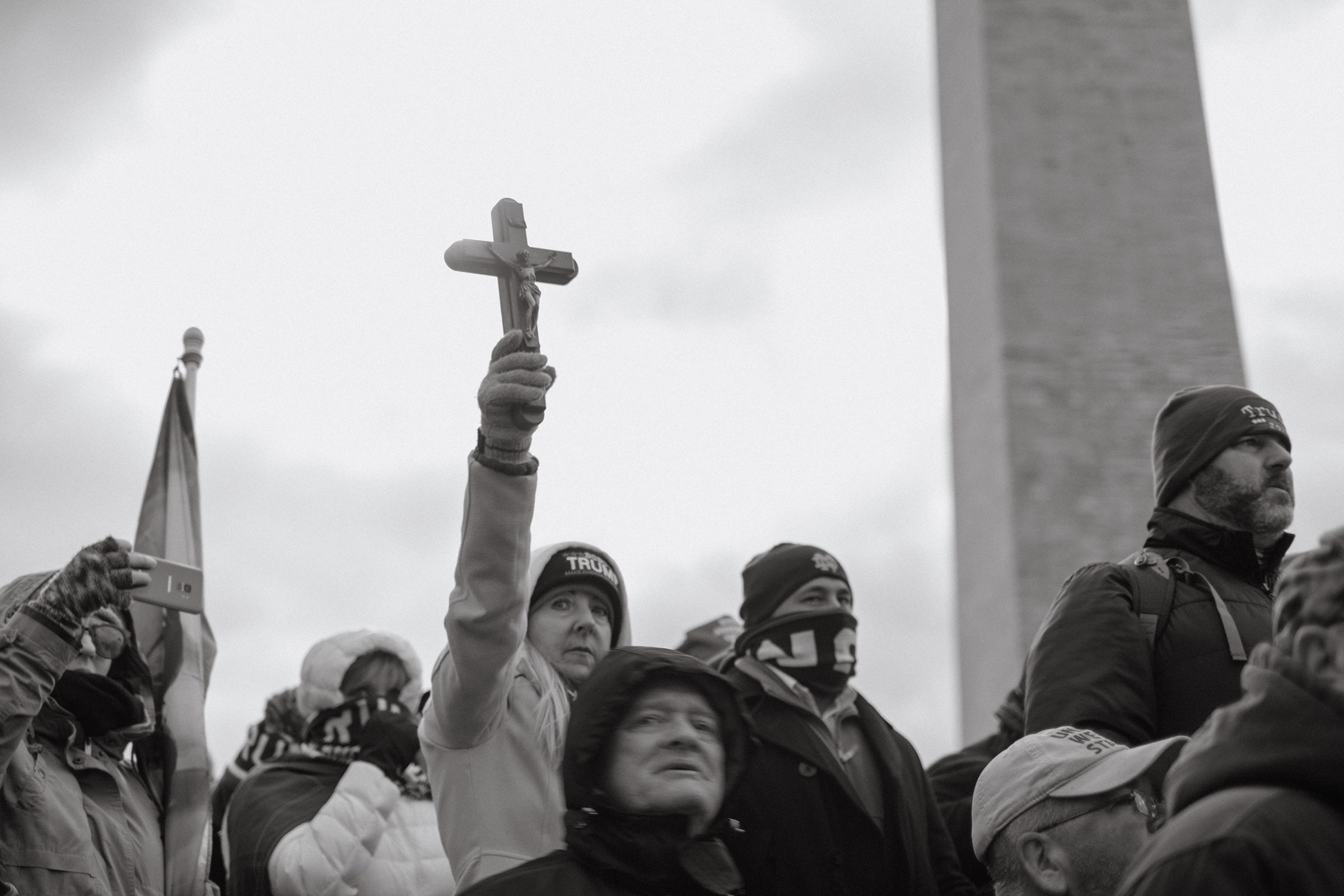 A supporter of President Donald Trump holds up a cross during the 'Stop the Steal' rally in Washington on Jan. 6, 2021. (Christopher Lee for TIME)
