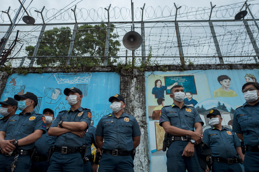 Police officers gather as they prepare to search the Manila City Jail premises for drugs and other illegal paraphernalias on Nov. 30, 2018. (Jes Aznar—Getty Images)