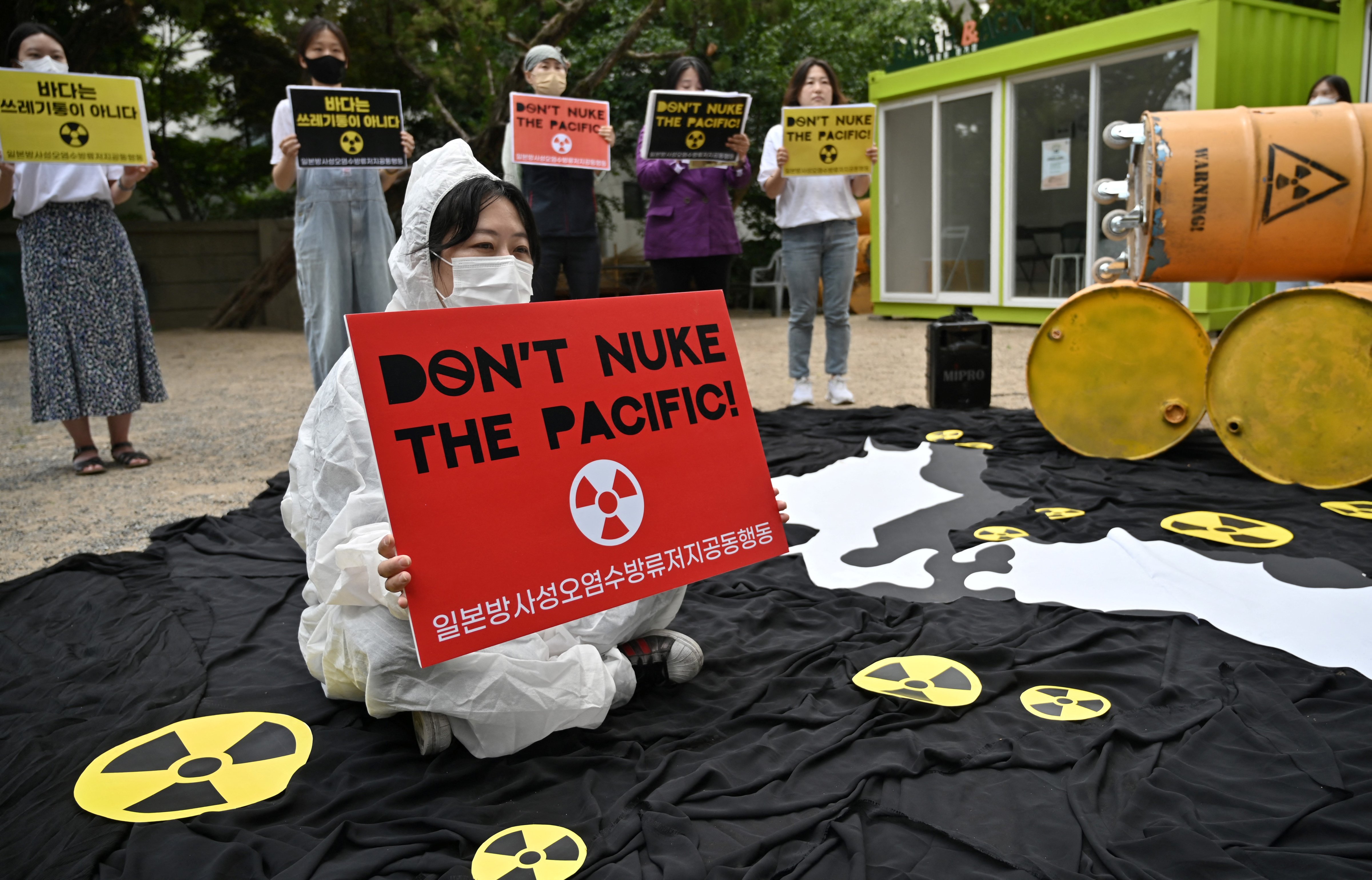 South Korean environmental activists protest in Seoul against Japan's plan to discharge Fukushima radioactive water into the sea, as they mark World Oceans Day on June 8, 2022. (Jung Yeon-je—AFP/Getty Images)