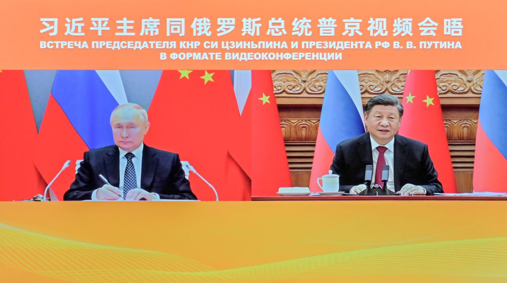 Chinese President Xi Jinping meets with Russian President Vladimir Putin via video link in Beijing, capital of China, Dec. 30, 2022. (Yue Yuewei-Xinhua via Getty Images)