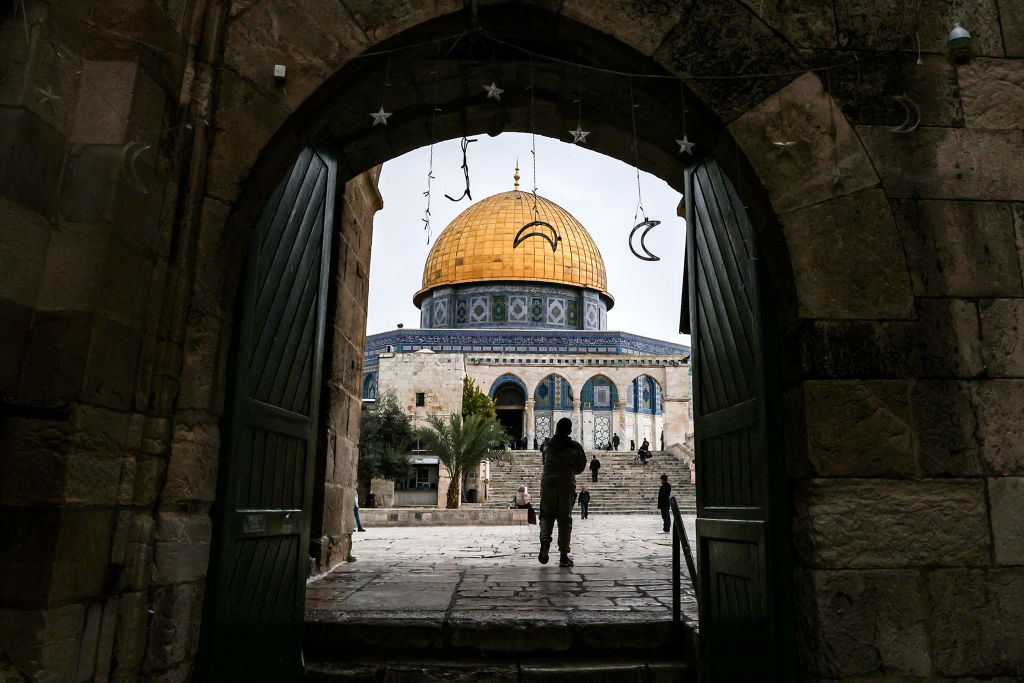 People walk toward the Dome of the Rock shrine at the Aqsa mosque compound (also known as the Temple Mount complex to Jews) in the old city of Jerusalem on Jan. 3, 2023. (Ahmad Gharabli—AFP via Getty Images)