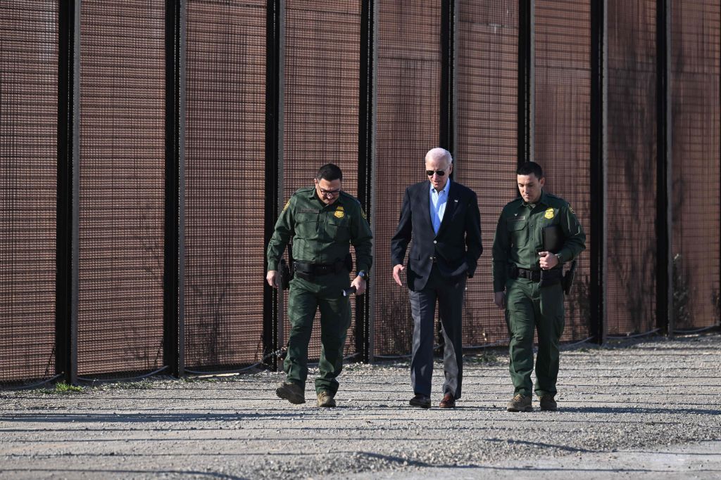 Biden walks by border fencing in El Paso. (Jim Watson—AFP via Getty Images)