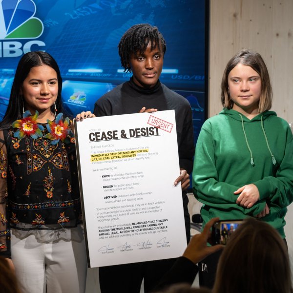 German climate activist of the  Fridays for Future  movement Luisa Neubauer (L), Ecuadorian environmental and human rights activist Helena Gualinga (2nd L), Ugandan climate justice activist Vanessa Nakate (2nd R) and Swedish climate activist Greta Thunberg (R) pose with a letter to CEOs of fossil fuel companies during the World Economic Forum (WEF) annual meeting in Davos, on January 19, 2023.