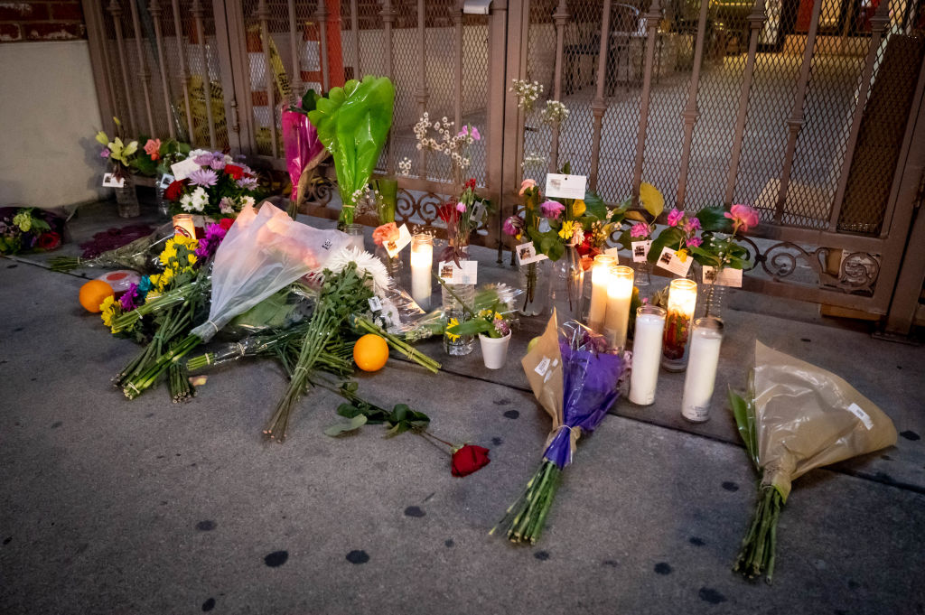 People have begun to leave flowers, candles, and other items at the Star Dance Studio in Monterey Park, Calif., for the victims of the mass shooting Monday, January 23, 2023. (David Crane—MediaNews Group/Los Angeles Daily News/Getty Images)