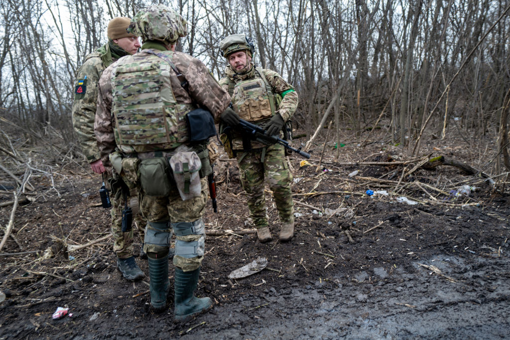 Ukrainian soldiers shelter in the woods along a road outside of the strategic city of Bakhmut on January 18, 2023 in Bakhmut, Ukraine. (Spencer Platt—Getty Images)