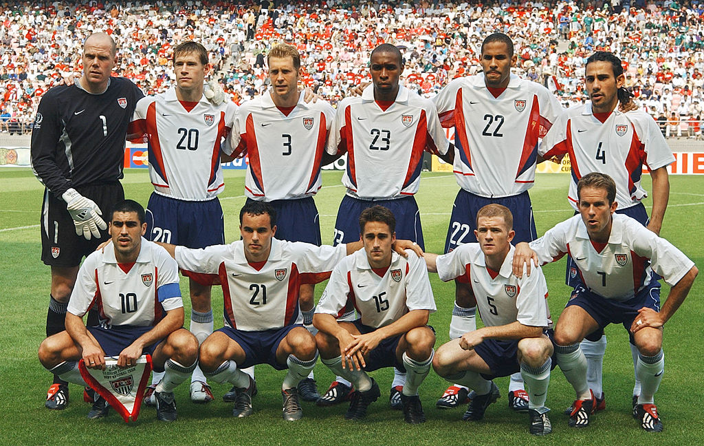 The starting team for a World Cup match against Mexico pose for a photo at Jeonju Stadium, South Korea, June 17, 2002. Left to right, from top: Brad Friedel, Brian McBride, Gregg Berhalter, Eddie Pope, Anthony Sanneh, Pablo Mastroeni, Claudio Reyna, Landon Donovan, Josh Wolff, John O'Brien, and Eddie Lewis. Earnie Stewart came on as a substitute during the game, which USA won 2-0. (Pascal Guyot—AFP/Getty Images)