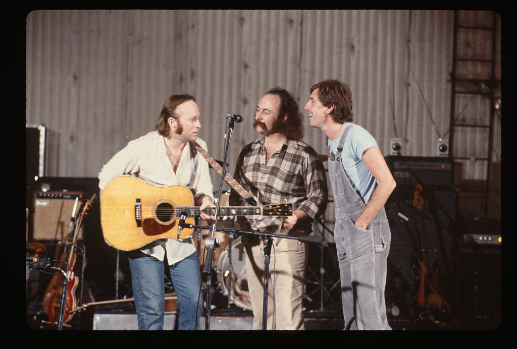 Left to right: Stephen Stills, David Crosby, and Graham Nash sing together in a barn circa 1970. (LGI Stock/Corbis/VCG/Getty Images)
