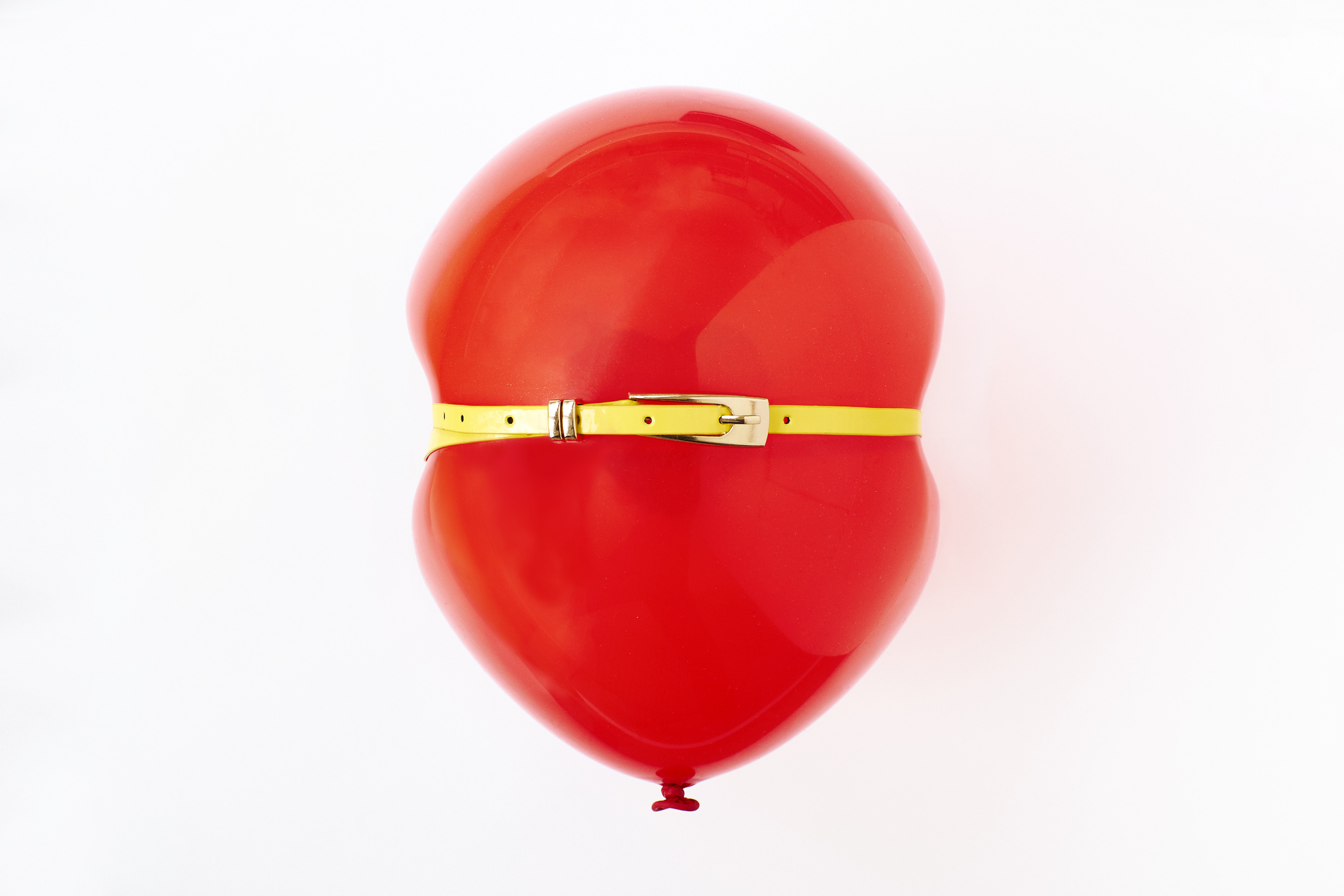 Red balloon, conceptual image of bloated stomach