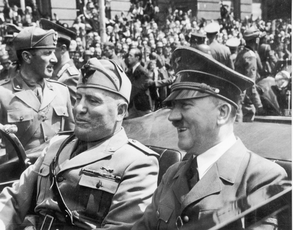 Adolf Hitler and Benito Mussolini riding in an open car, circa 1940s. (Fotosearch/Getty Images)