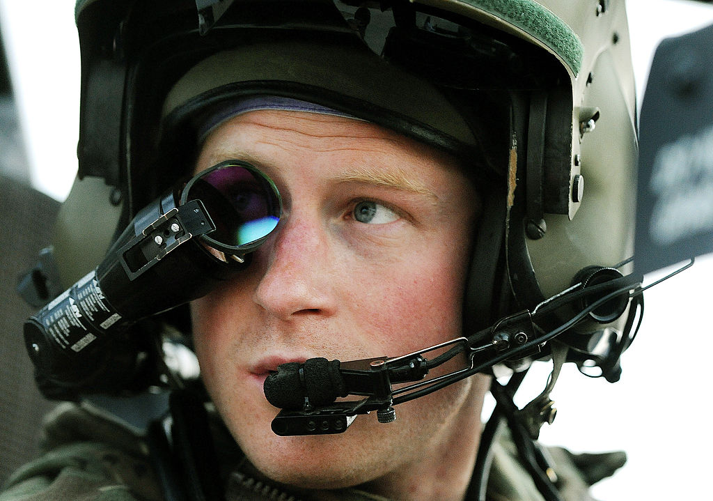 In this image released on Jan. 21, 2013, Prince Harry, wears his monocle gun sight as he sits in the front seat of his cockpit at the British controlled flight-line at Camp Bastion on December 12, 2012 in Afghanistan. Prince Harry has served as an Apache helicopter pilot/hunner with the British Army Air Corps from September 2012 for four months until January 2013. (John Stillwell–WPA Pool/Getty Images)