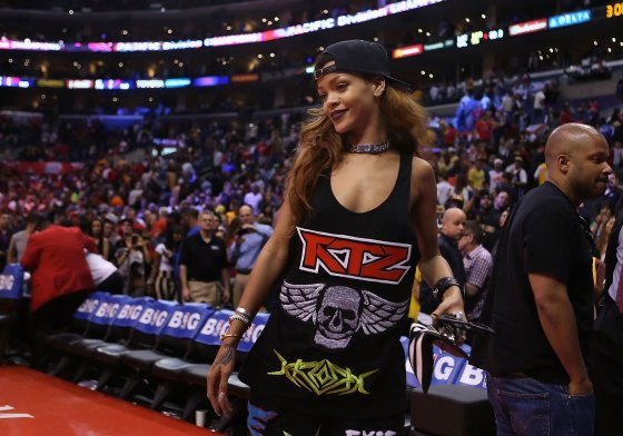 Rihanna walks off the court following the NBA game between the Los Angeles Lakers and the Los Angeles Clippers in Los Angeles, on April 7, 2013.