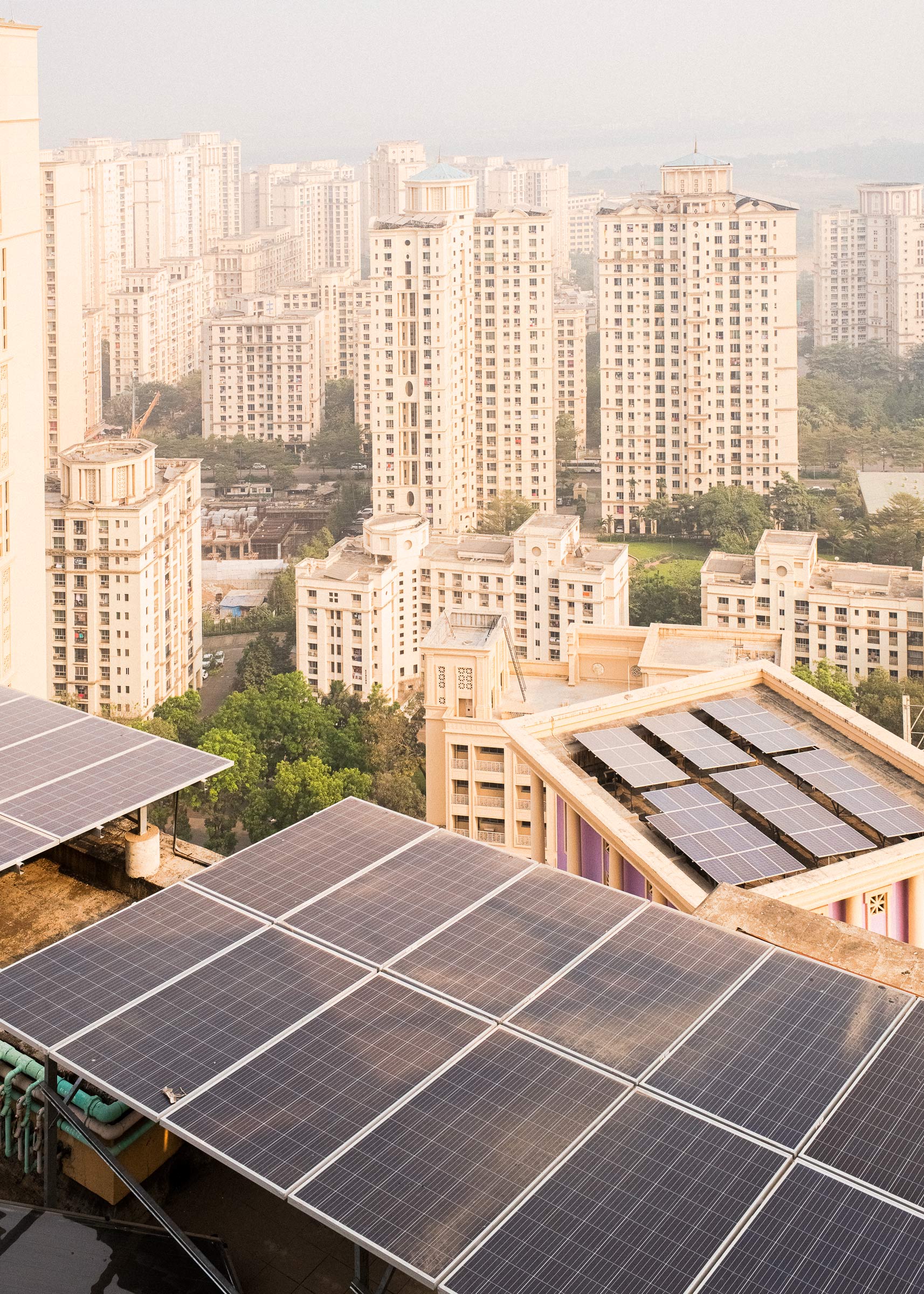 Solar panels installed by Koku Solar Pvt. Ltd line the rooftops of residential buildings in Mumbai, allowing them to run using green energy. (Sarker Protick for TIME)