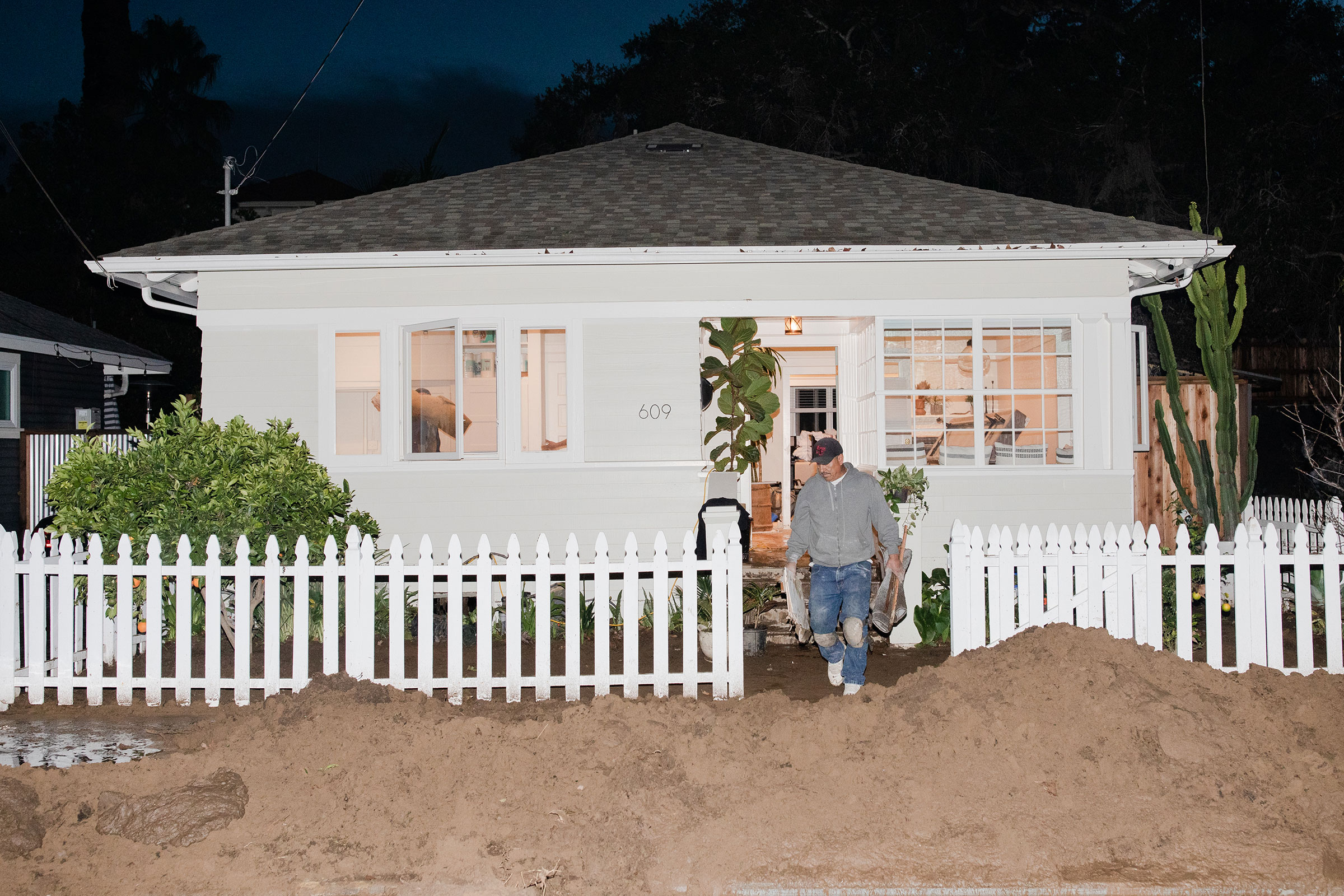 SANTA BARBARA, CALIFORNIA - January 10th, 2023: The cleanup of a damaged house in the aftermath of flooding on Bath Street in Santa Barbara on Tuesday.CREDIT: Alex Welsh for TIME