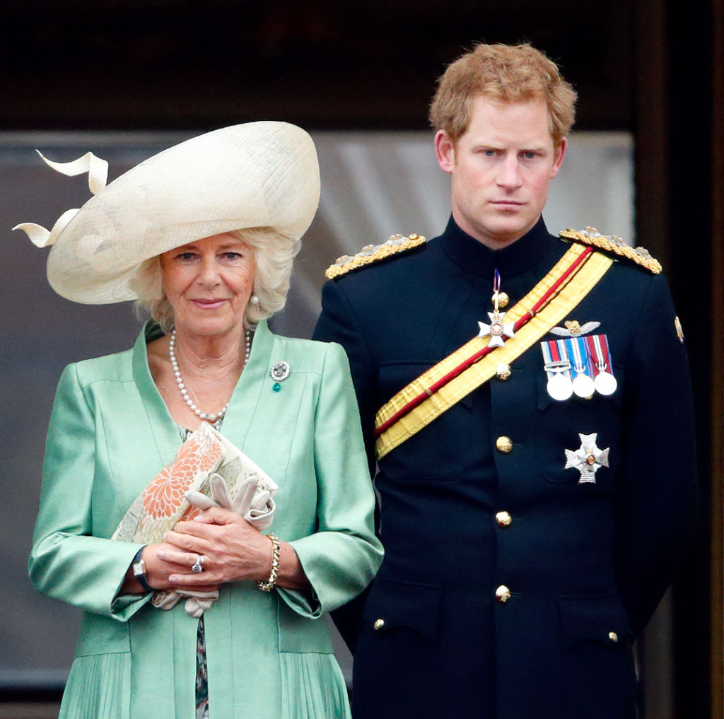 Camilla, Duchess of Cornwall and Prince Harry stand on the balcony of Buckingham Palace during Trooping the Colour on June 13, 2015 in London.