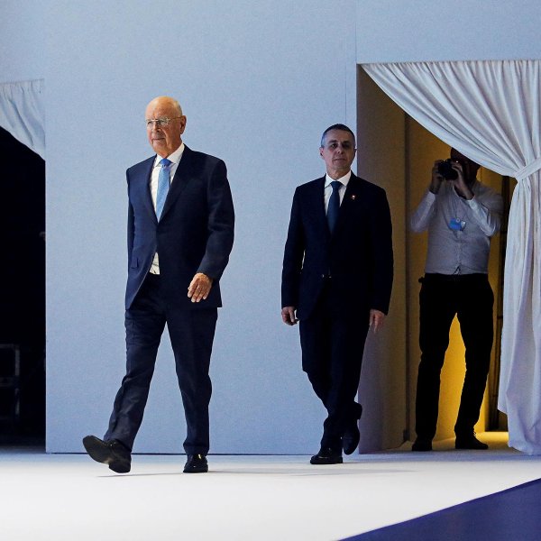 Swiss President Ignazio Cassis and Founder and Executive chairman Klaus Schwab arrive for the opening ceremony of the World Economic Forum in Davos, Switzerland May 23, 2022.