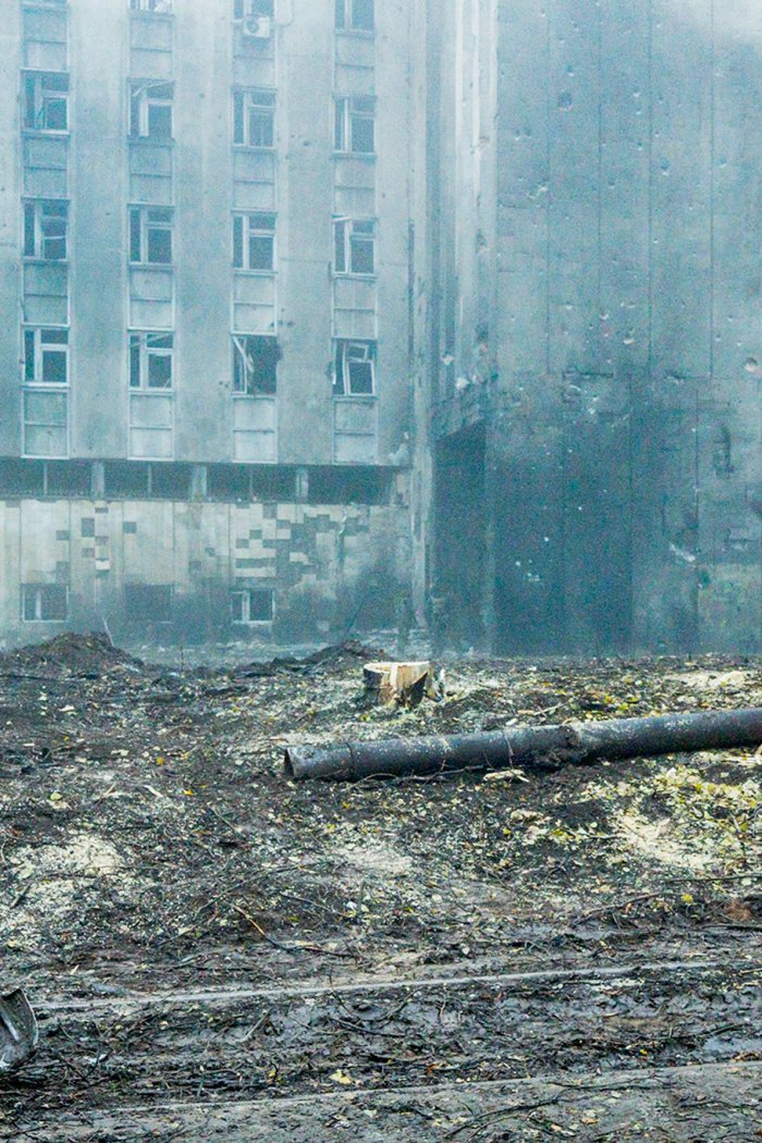 A worker cleans the debris in the streets of Dnipro on Nov. 17, 2022 after a Russian missile impacted in the city.