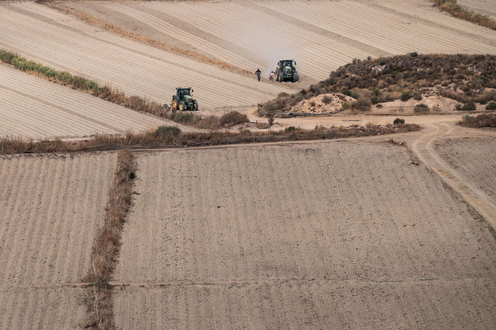Farmers prepare the land for planting the next crop in Garrucha, Spain, on Aug. 30, 2022, amid a summer of drought and extreme temperatures. (Marcos del Mazo/LightRocket— Getty Images)