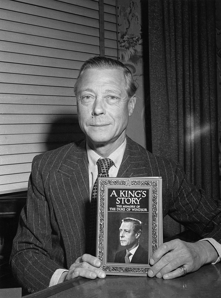 The Duke of Windsor (1894 - 1972), formerly King Edward VIII, with his memoirs, entitled 'A King's Story: The Memoirs of the Duke of Windsor', circa 1951. (Erika Stone—Getty Images)