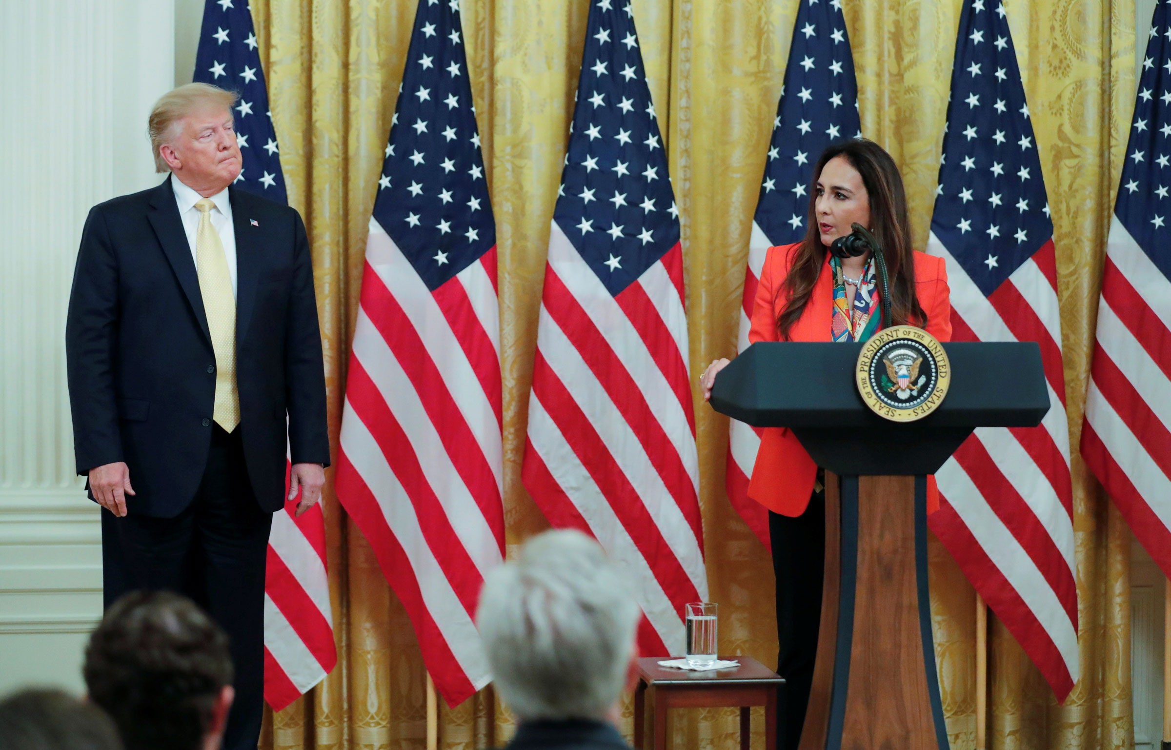 President Donald Trump listens as attorney Harmeet Dhillon addresses his social media summit with prominent conservative social media figures in the East Room of the White House in Washington, D.C., on July 11, 2019. (Carlos Barria—Reuters)