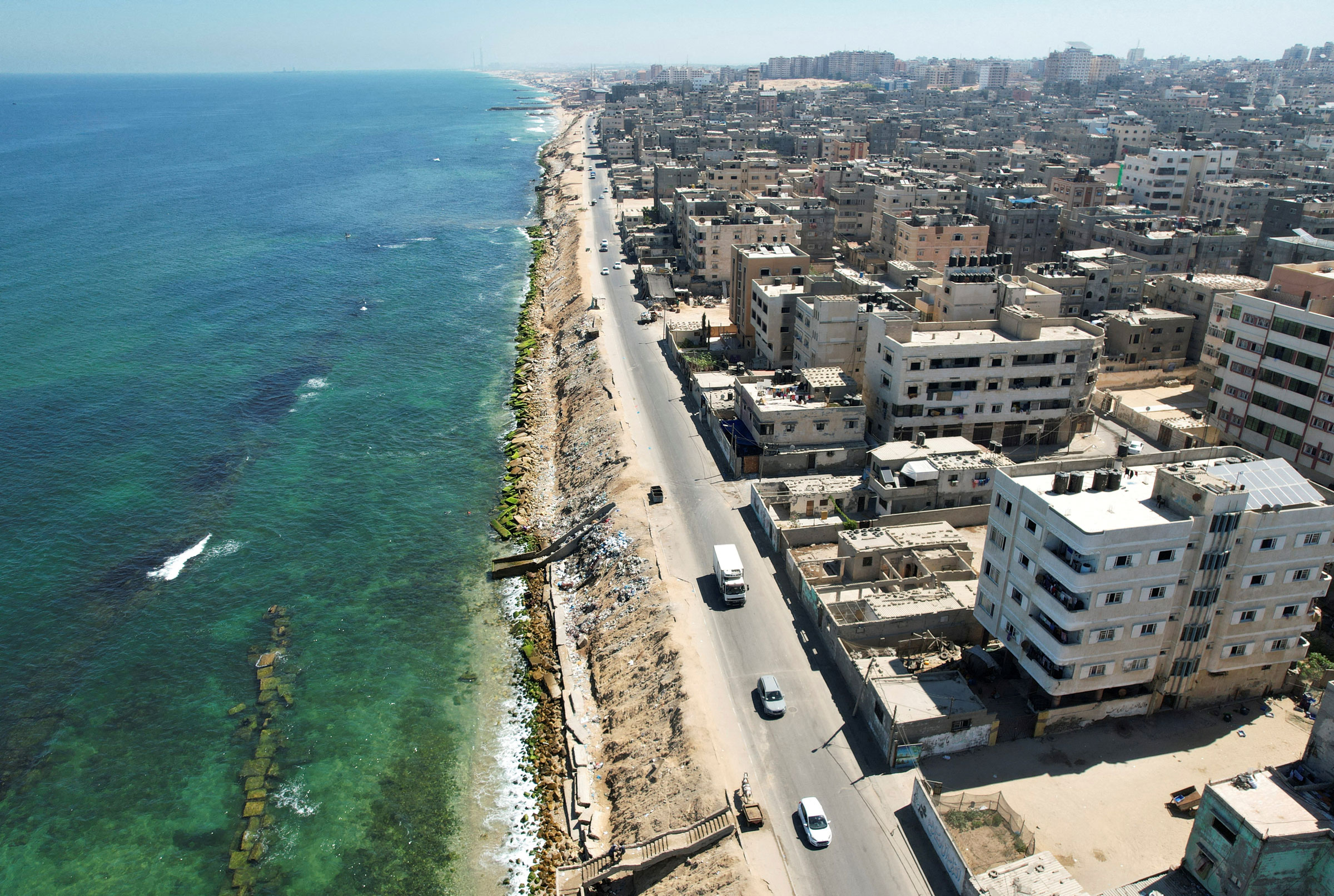 A view of Beach refugee camp shows the erosion of the shore and new vertical wave breakers placed inside the sea in Gaza City on July 26, 2022.