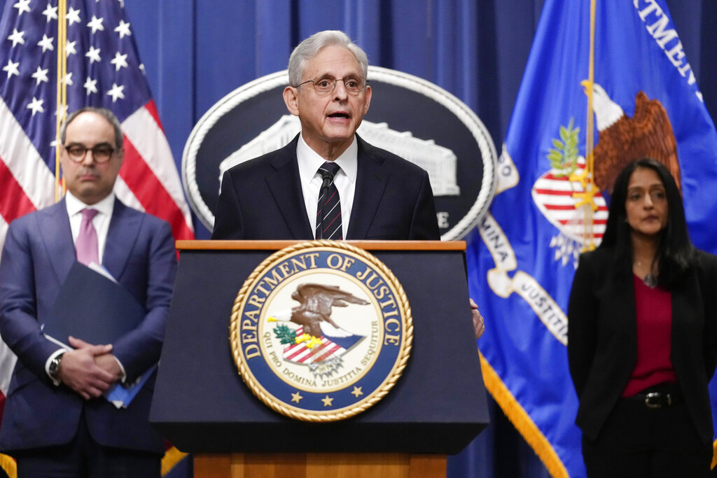Attorney General Merrick Garland, joined by Associate Attorney General Vanita Gupta and Assistant Attorney General Jonathan Kanter of the Justice Department's Antitrust Division, speaks at the Department of Justice in Washington, Tuesday, Jan. 24, 2023. (Carolyn Kaster—AP)
