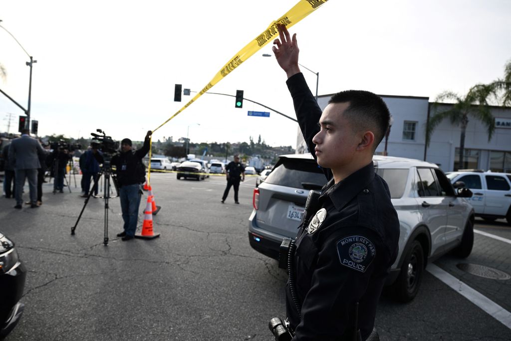 Police let investigators onto the scene of a mass shooting in Monterey Park, Calif., on Jan. 22, 2023. (Robyn Beck—AFP /Getty Images)
