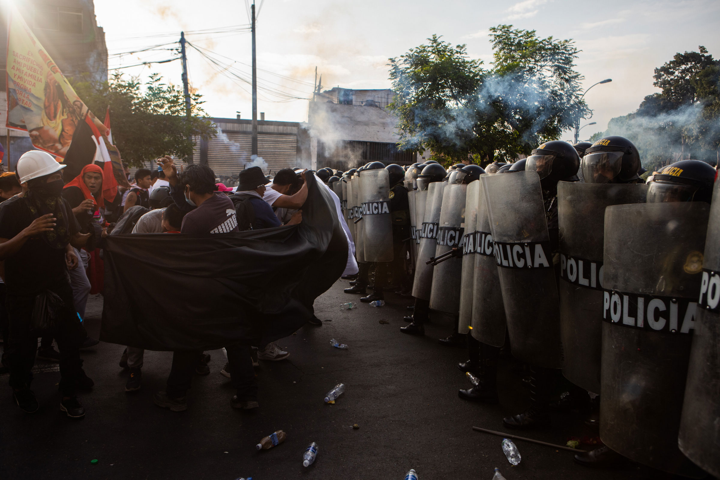 Protesters who want President Dina Boluarte to resign face off with police in Lima, Peru, on Jan. 19, 2023. (Marco Garro—The New York Times/Redux)