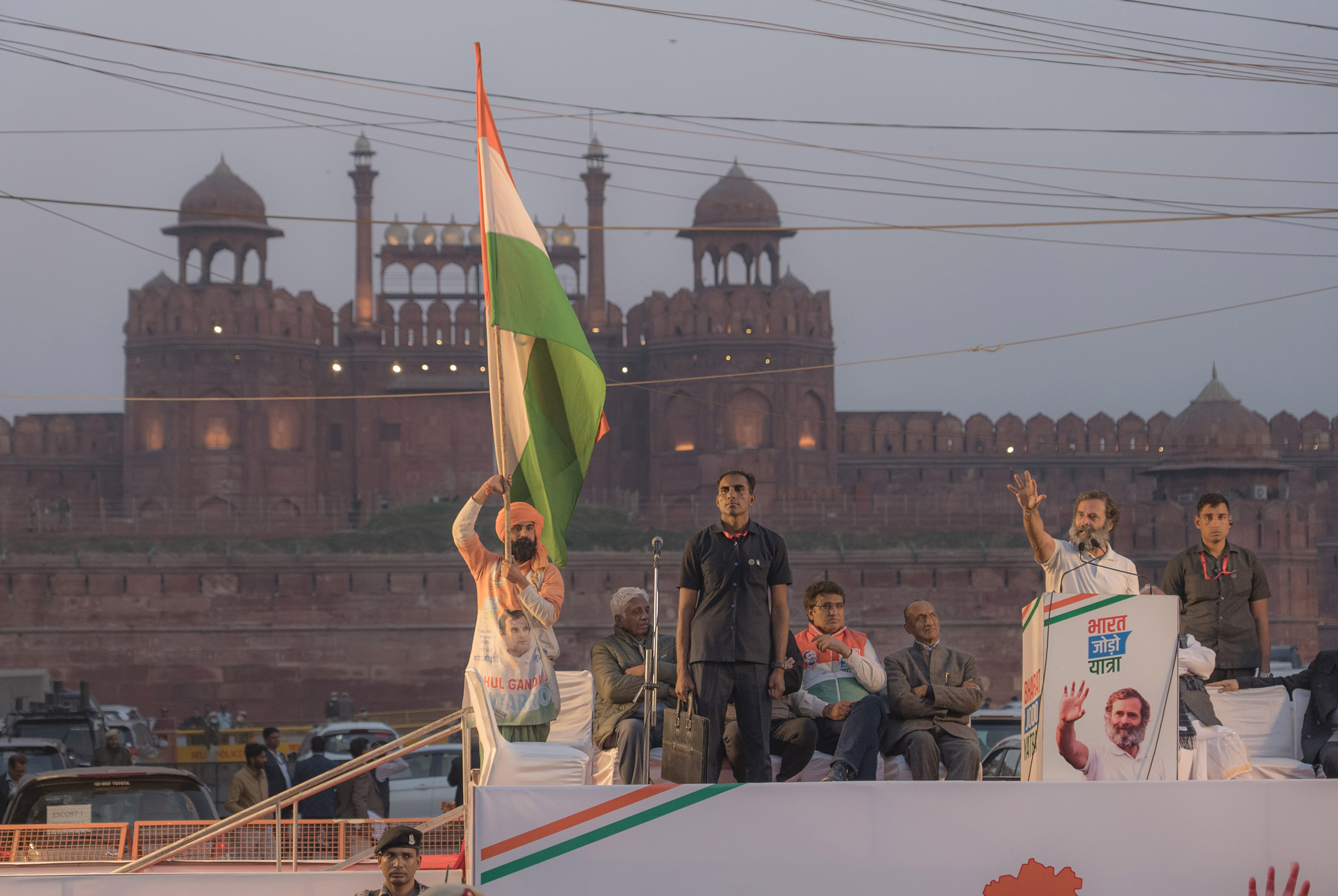 Rahul Gandhi addresses his supporters in front of the Red Fort during the Bharat Jodo Yatra in New Delhi, India on Dec. 24, 2022. He is sharing the stage with Mallikarjun Kharge, the president of Indian National Congress, and film star Kamal Haasan. (Ronny Sen for TIME)