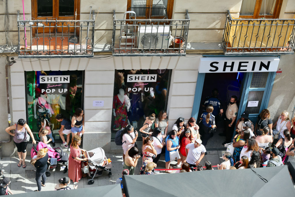 A crowd waits to enter the first physical SHEIN store in Madrid, on June 2, 2022. (Cezaro De Luca—Europa Press/Getty Images)