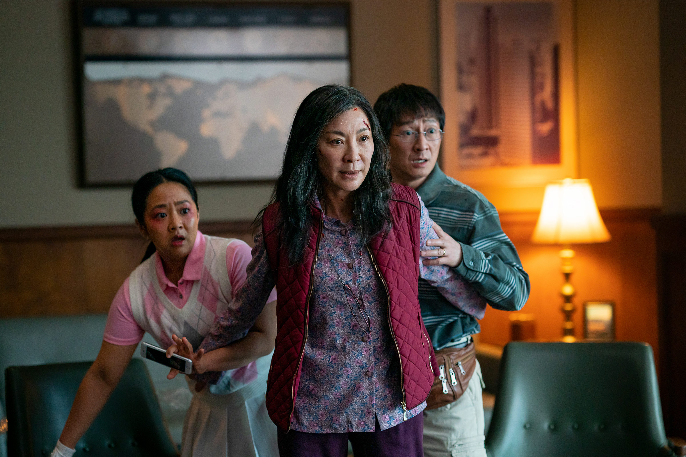 Stephanie Hsu as Joy Wang, Michelle Yeoh as Evelyn Quan Wang and Ke Huy Quan as Waymond Wang in <i>Everything Everywhere All At Once</i>. (Allyson Riggs—A24)
