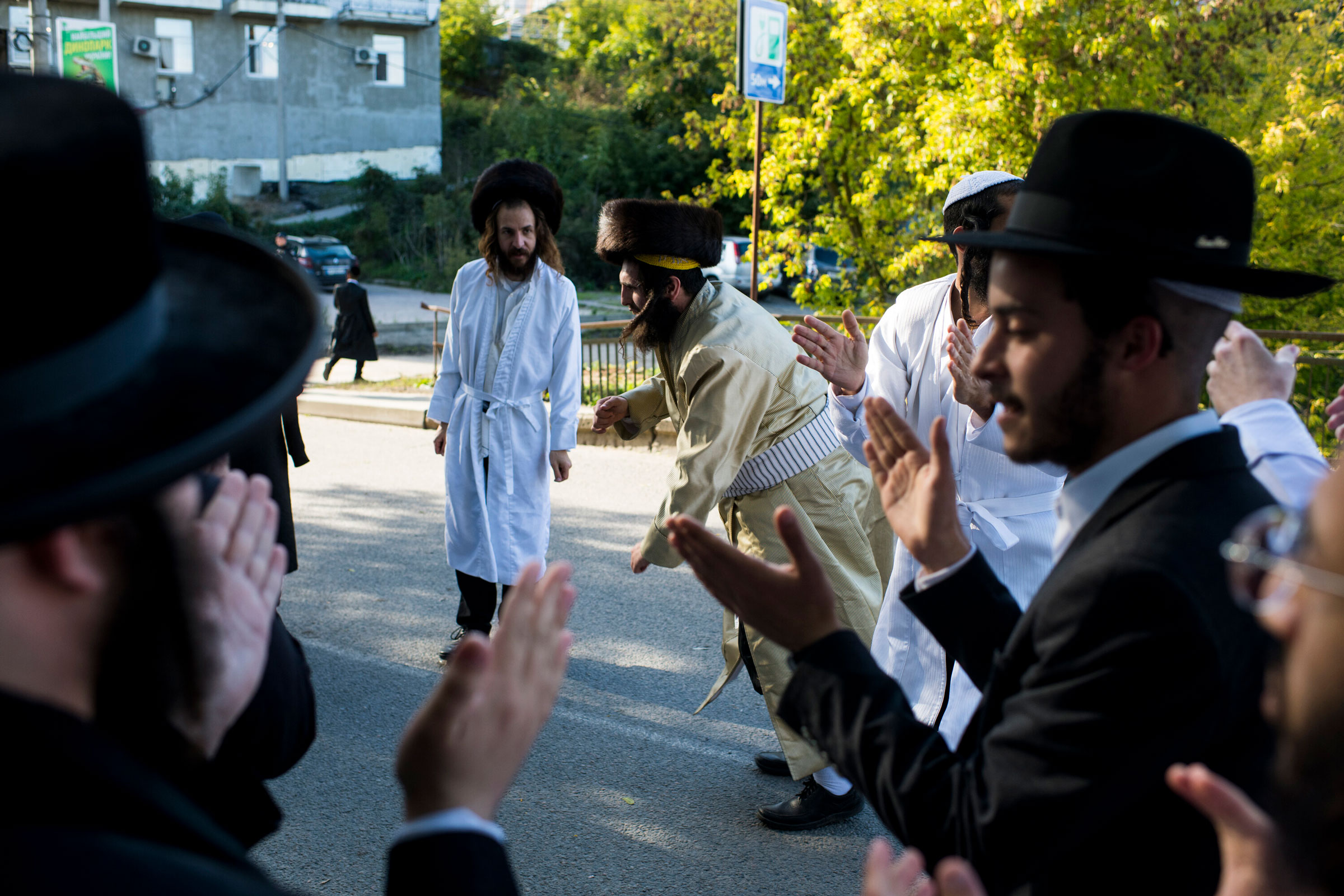 Hasidic pilgrims sing and dance during the annual Rosh Hashanah pilgrimage to the tomb of Rabbi Nachman of Breslov in Uman, Ukraine, on Sept. 27, 2022. (Pete Kiehart—Redux)