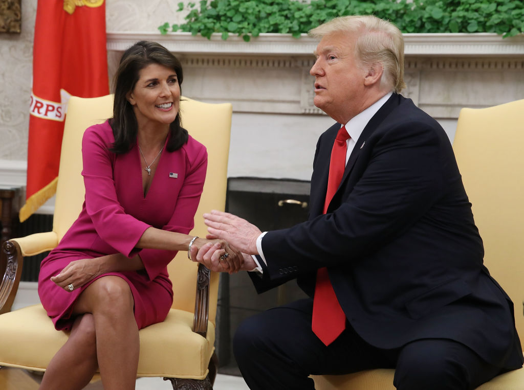 President Donald Trump with Nikki Haley, who was stepping down as his US Ambassador to the United Nations, in the Oval Office on October 9, 2018 in Washington, DC. Both are now 2024 candidates for President. (Mark Wilson—Getty Images)