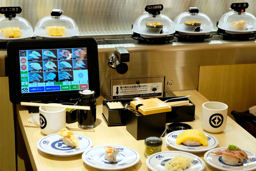 An order screen and various dishes at a Japanese conveyor belt sushi restaurant chain in the popular tourist area of Asakusa in Tokyo. (Kazuhiro Nogi—/AFP via Getty Images)
